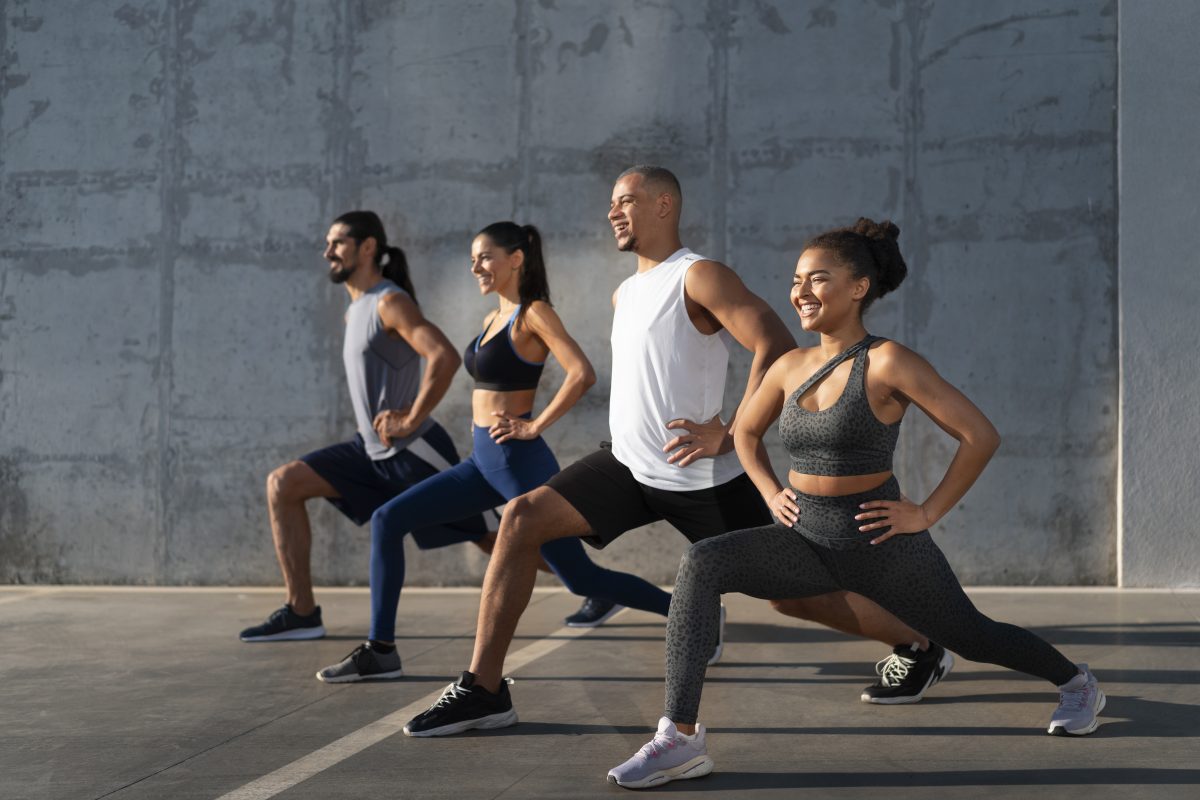 Group people exercising together outdoors